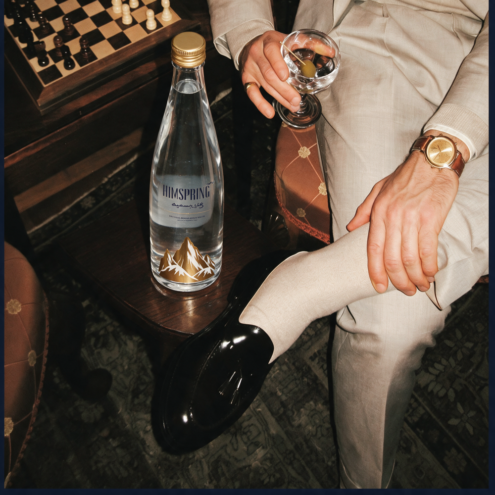 A Himspring bottle on a side table in a private members' club
